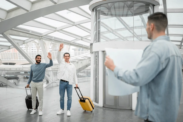 Driver greeting passenger at the priority area